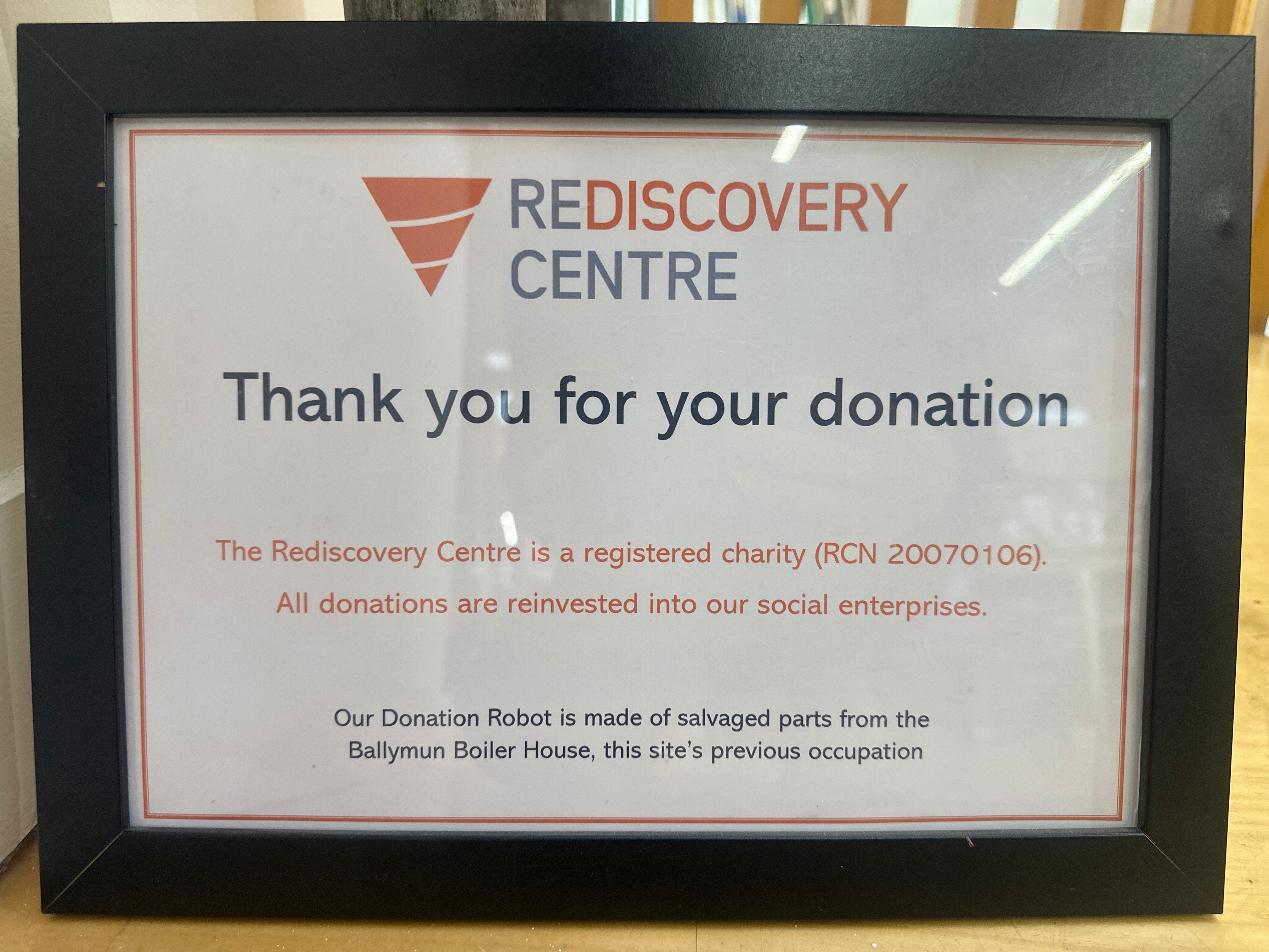 Framed sign from Rediscovery Centre thanking visitors for donations, with information about where donations go