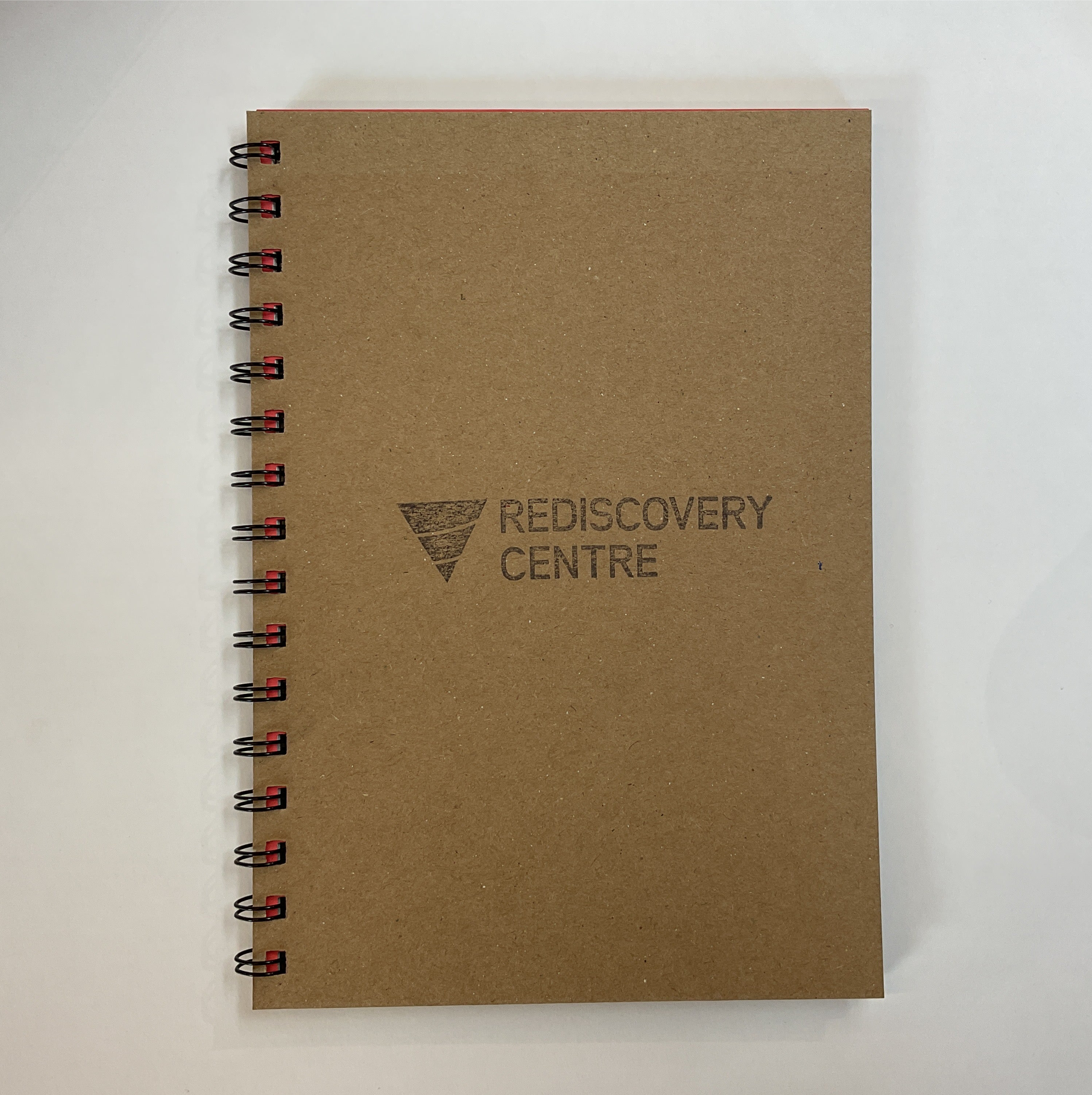 Brown notebook with 'Rediscovery Centre' logo on a white background