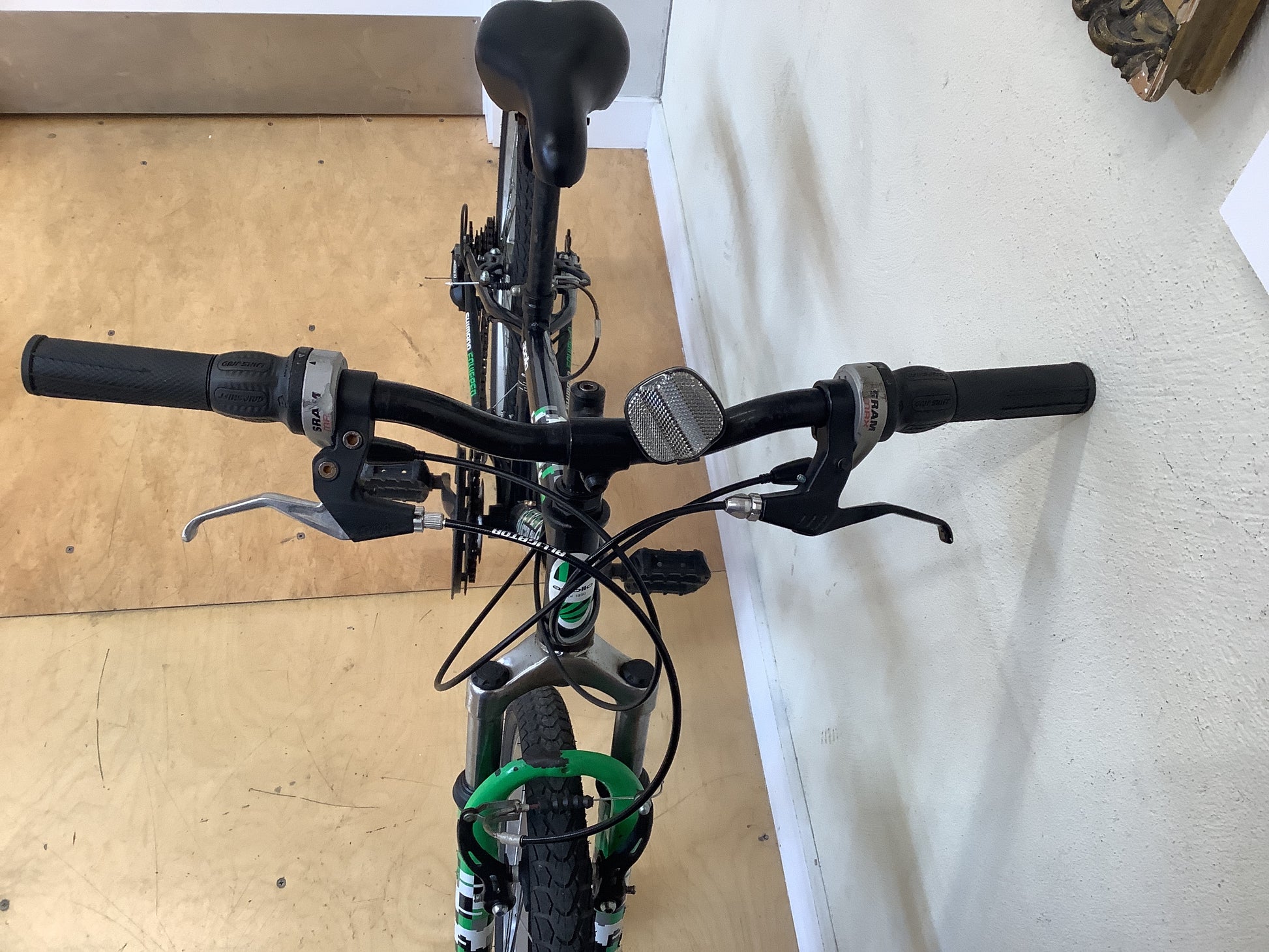 Apollo Gridlock 24" Bicycle handlebars with black grips and brake levers.