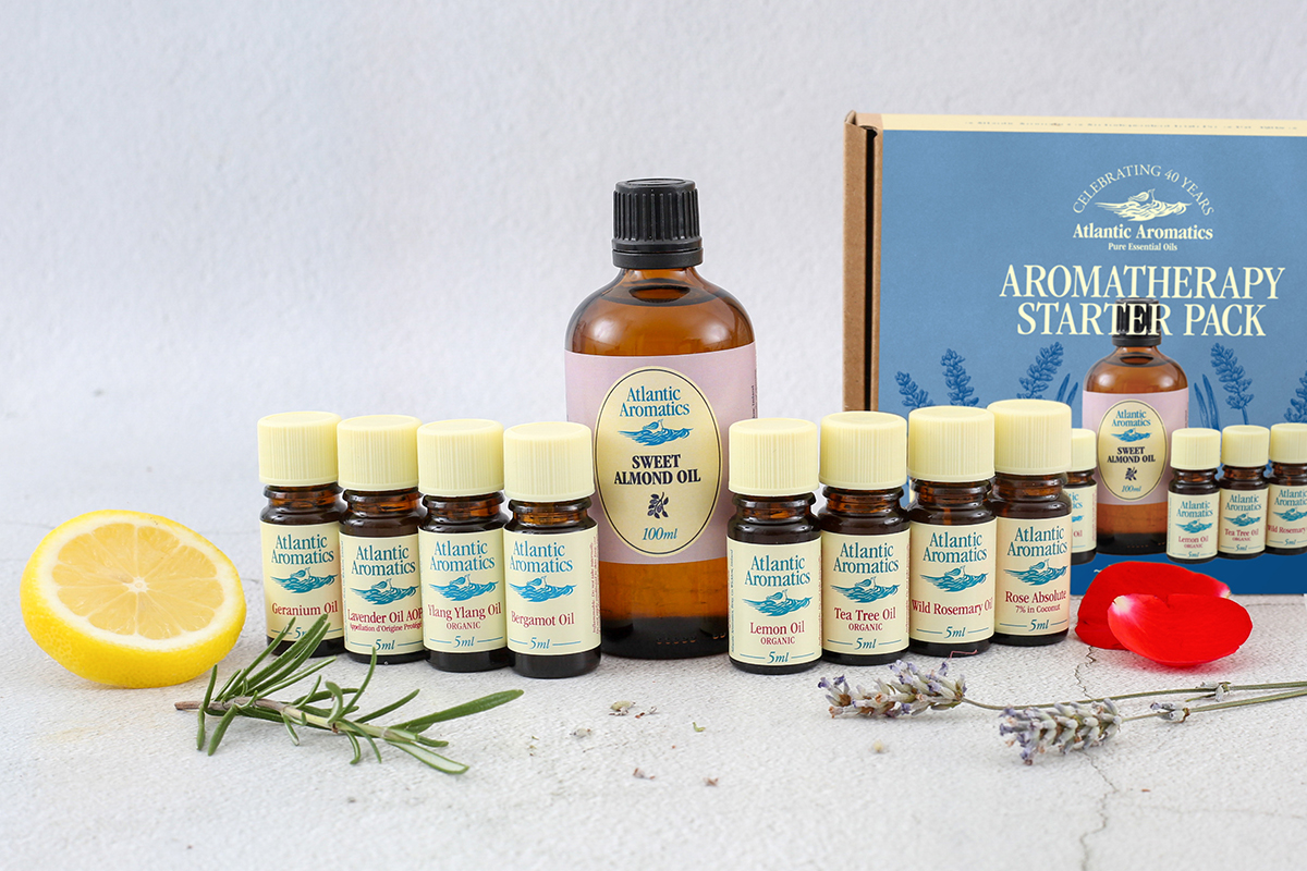 Aromatherapy starter pack with bottles and a box on a light background