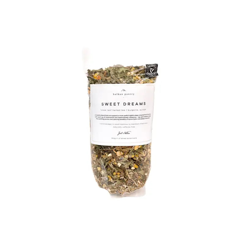 Bag of 'Sweet Dreams' herbal tea mix with a white label on a white background