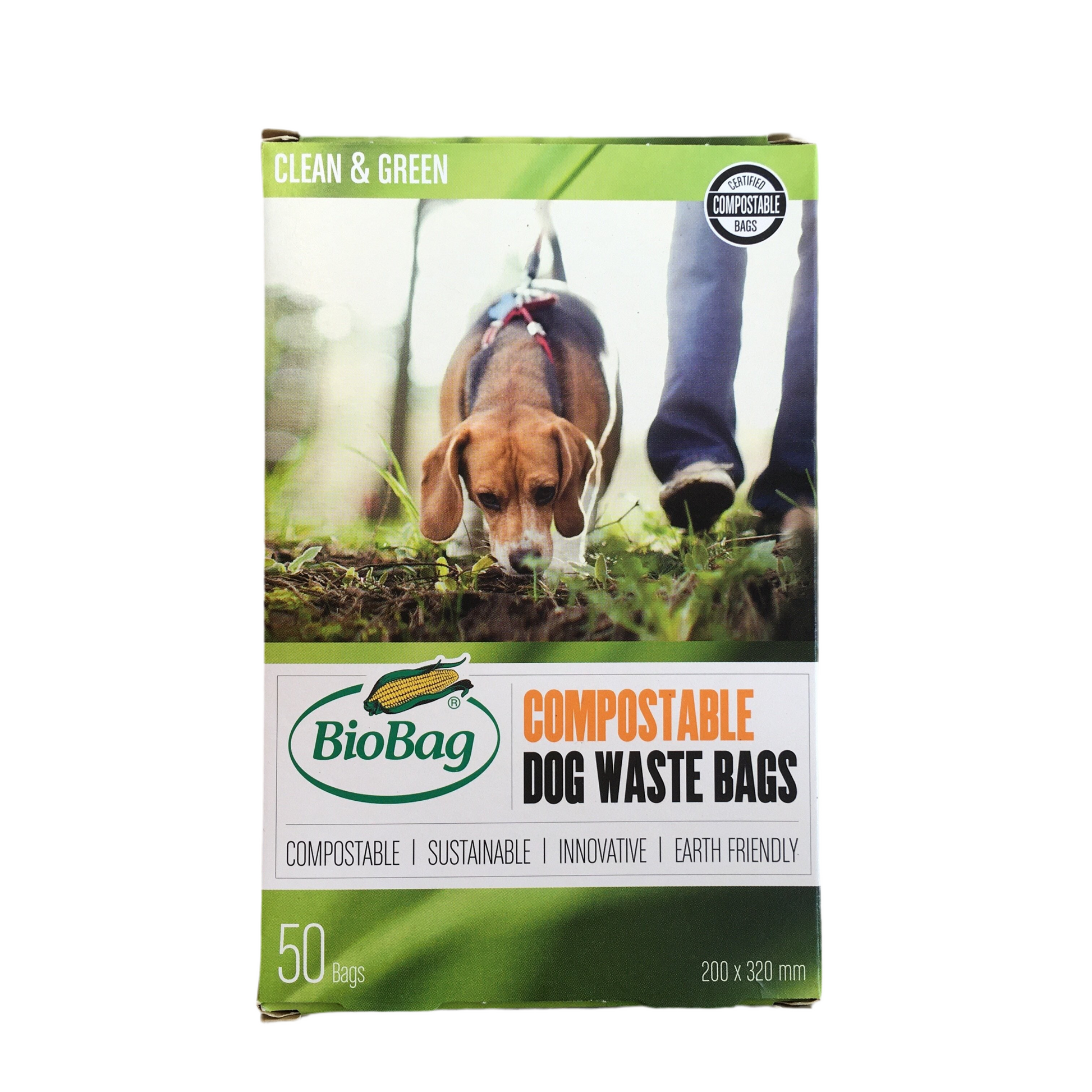 Box of Biobag compostable dog waste bags with a dog and person on a leash in the background.