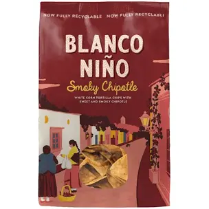 Blanco Niño Smoky Chipotle tortilla chips packaging with a village scene illustration.