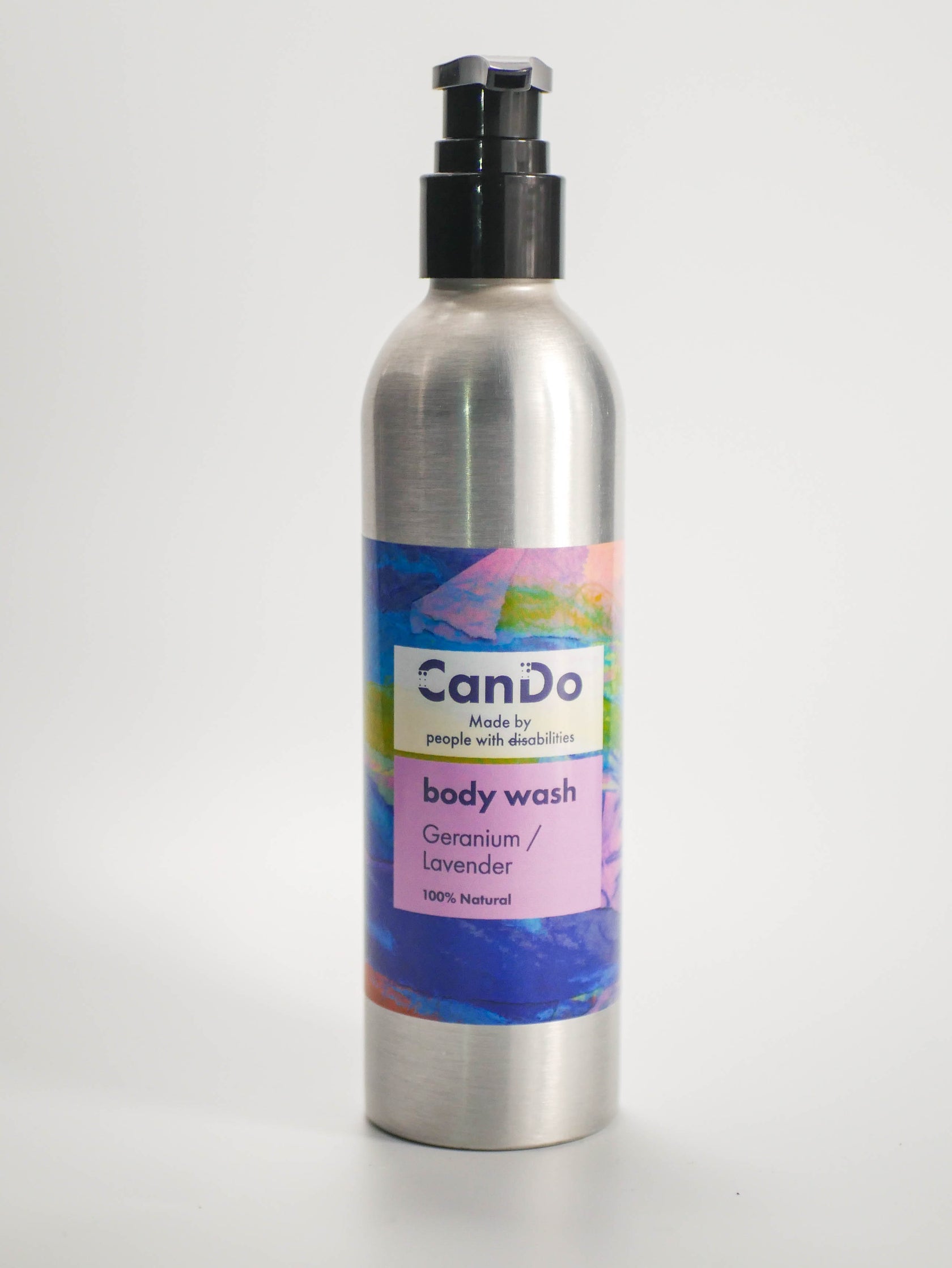Silver bottle of CanDo body wash with a colorful label on a white background