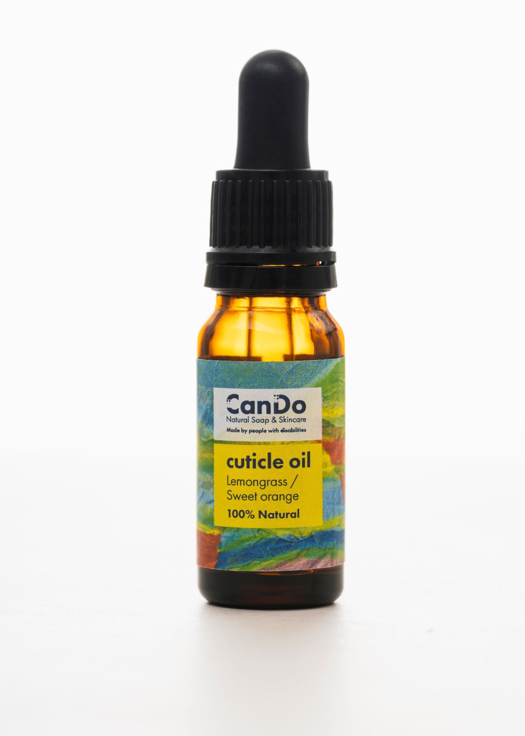 Bottle of CanDo cuticle oil with colorful label on a white background