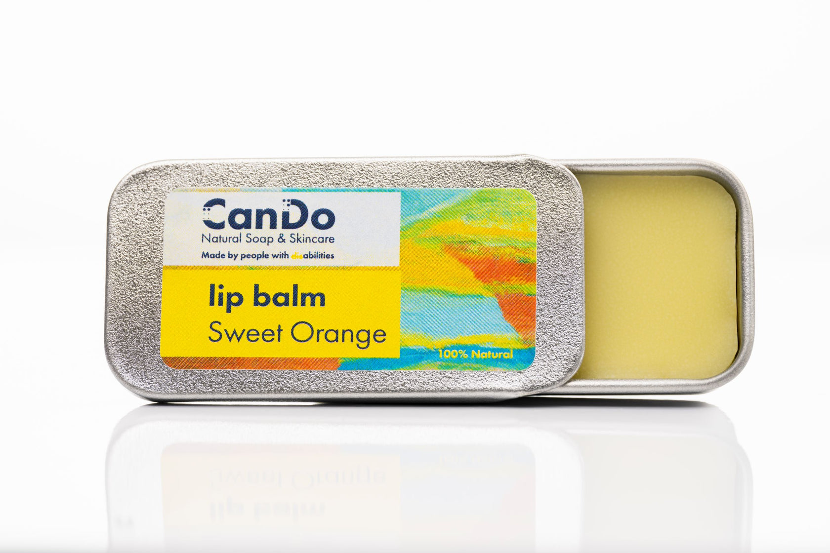 CanDo lip balm in a tin with a colorful label on a white background