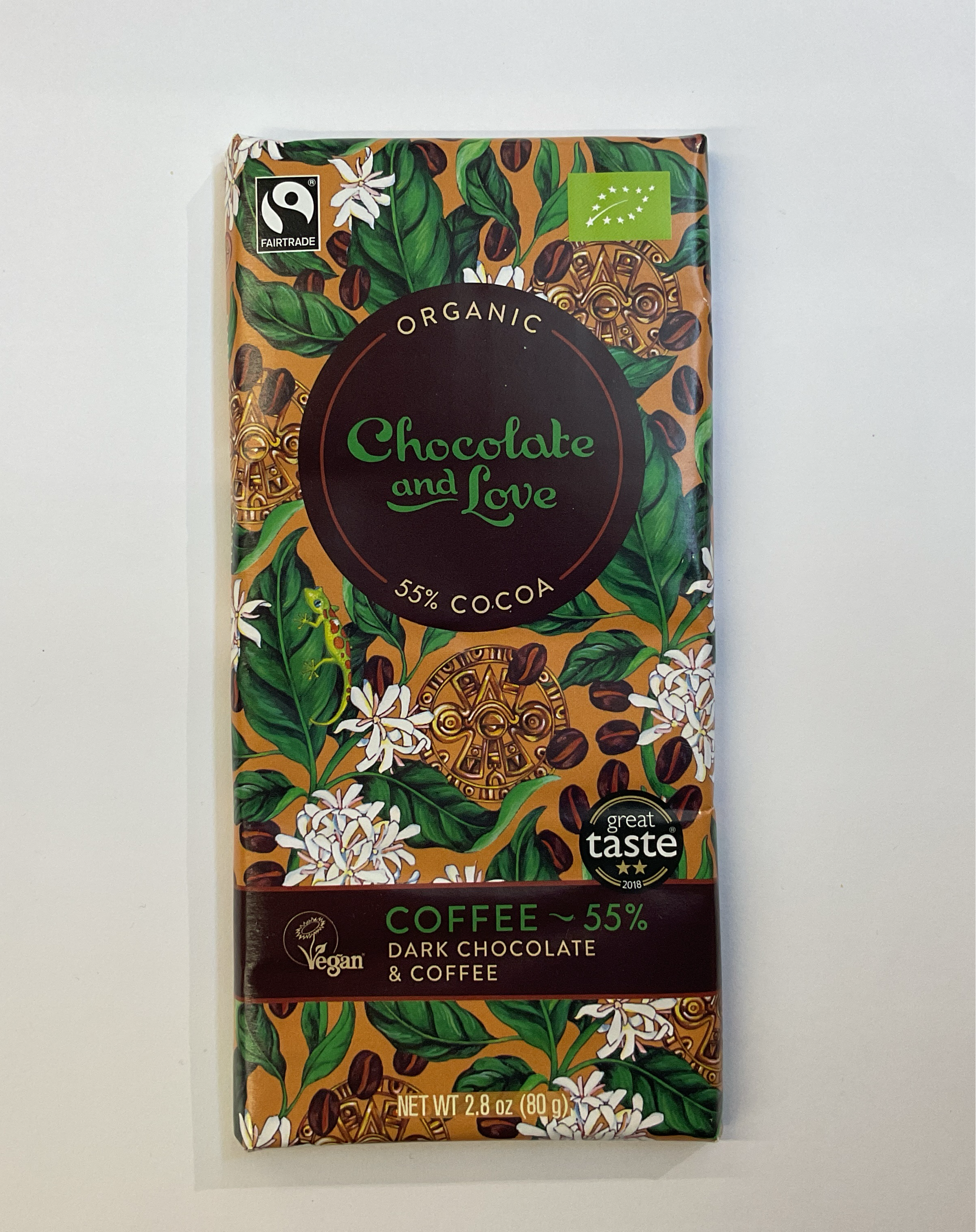 A package of organic dark chocolate with coffee flavor, indicating 55% cocoa content, with floral and coffee bean graphics.