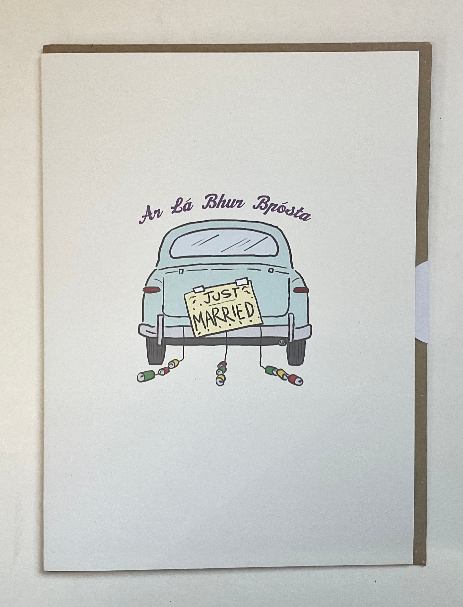 Framed artwork of a car with a 'Just Married' sign on a white background