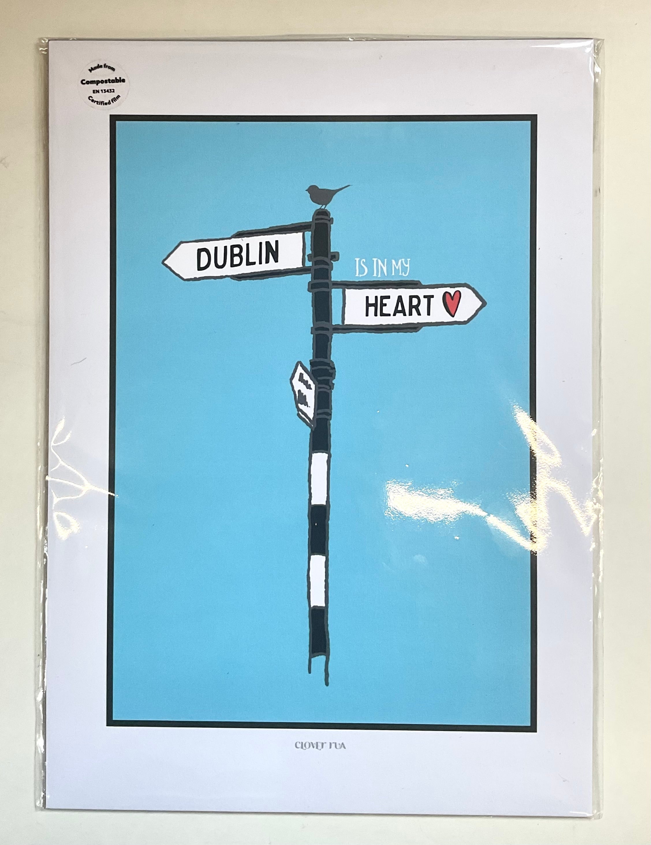 Framed artwork of a street sign with 'Dublin is my heart' on a blue background