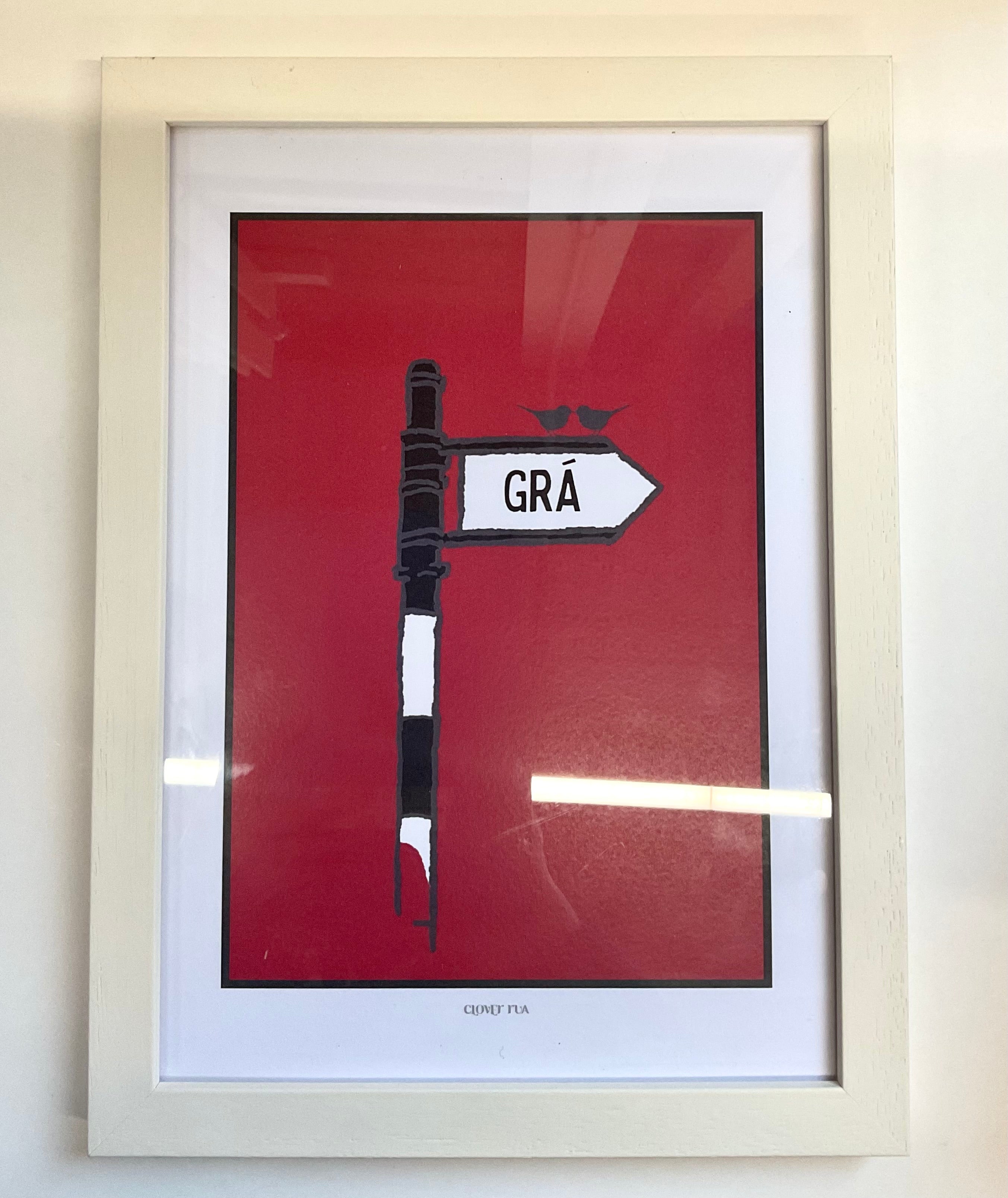 Framed artwork with a red background, black and white design, and 'GRA' text.