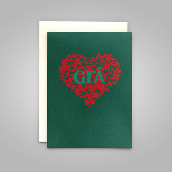Green card with red heart-shaped design and 'GIA' text on a gray background
