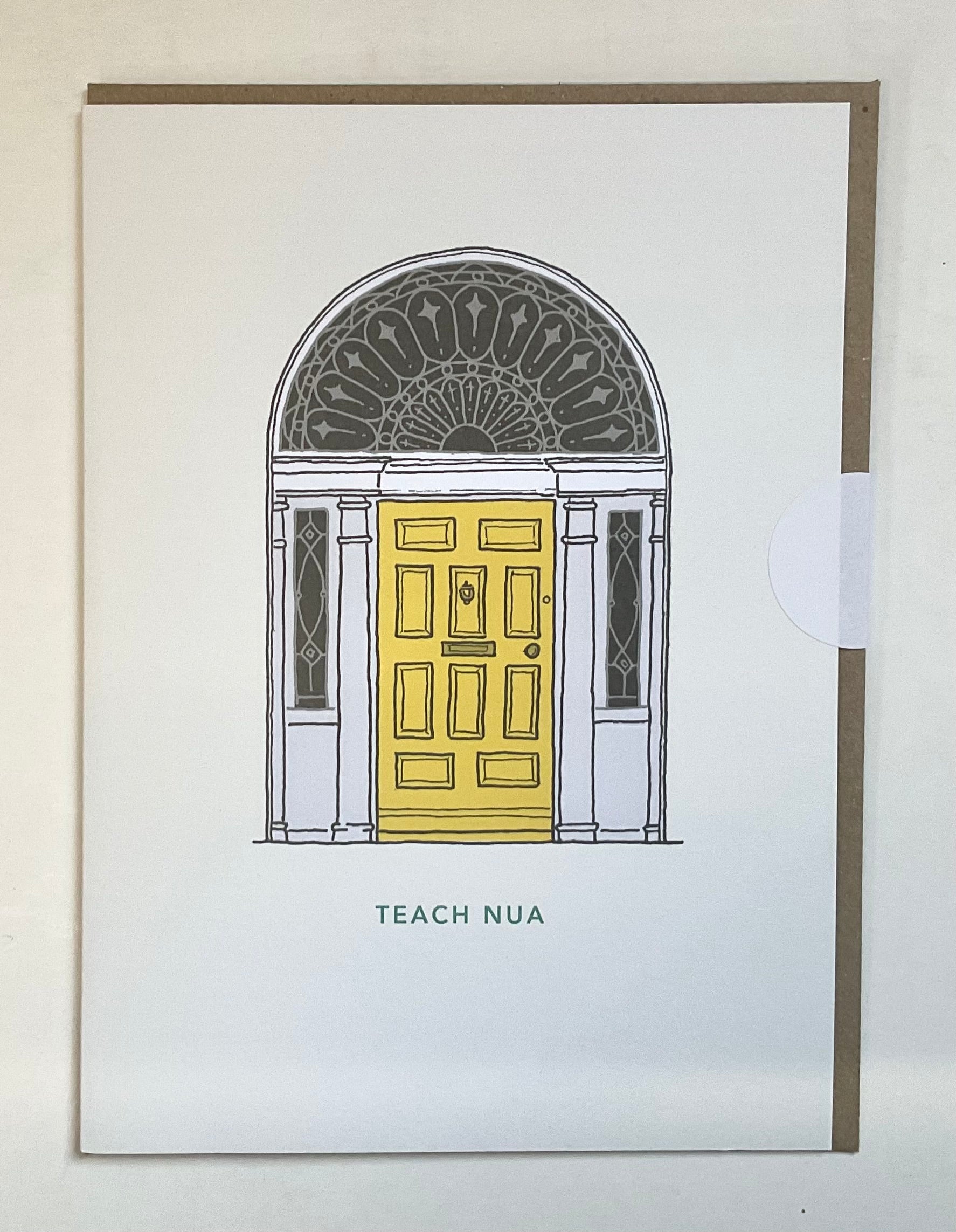 Framed artwork of a yellow door with decorative archway, labeled 'TEACH NUA'.