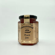 A jar of Crossogue Peach Jam with a label indicating it is made in Tipperary, Ireland, and that it is peach flavored.