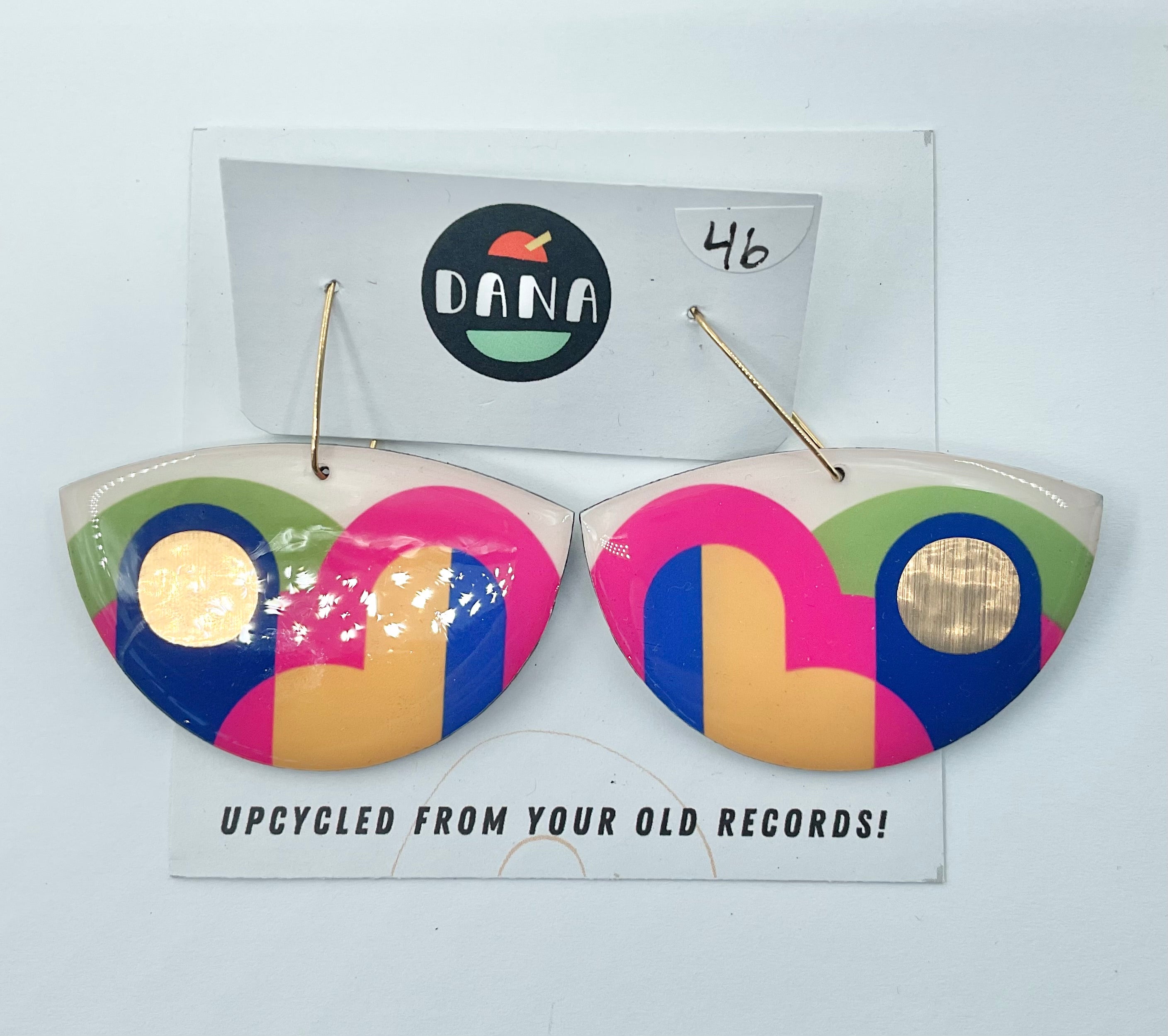A pair of Dana Jewellery Lola Earrings in boat shape with colors pink, yellow, green, blue, displayed on a white background with the brand name 'DANA' above and the earrings number '46' marked below.