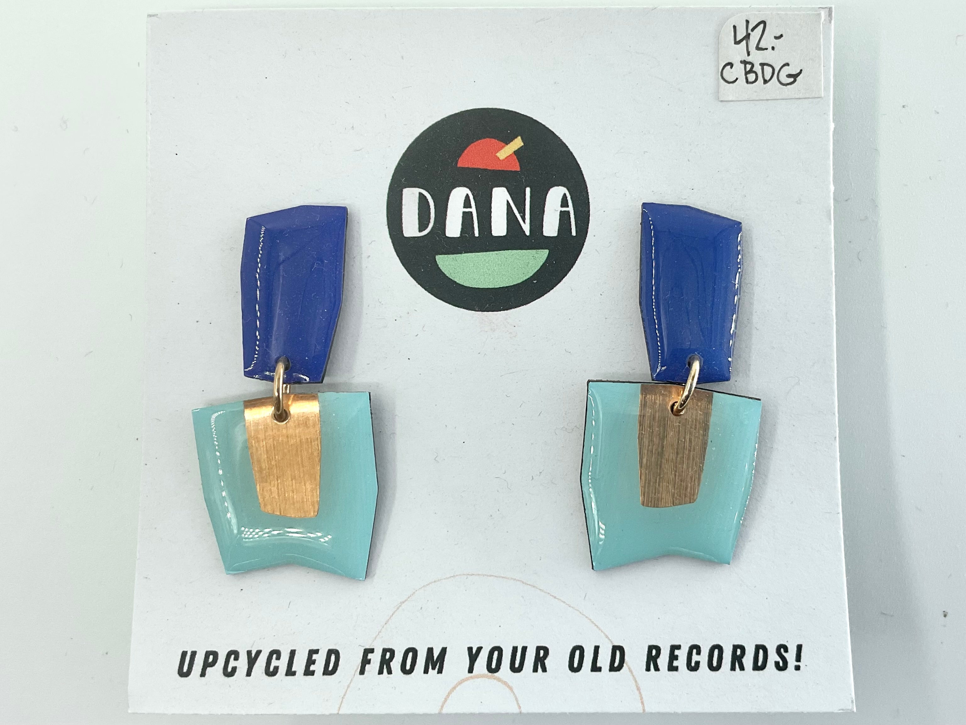 A pair of blue and turquoise earrings made from upcycled vinyl records, displayed on a card with the brand name 'DANA'.