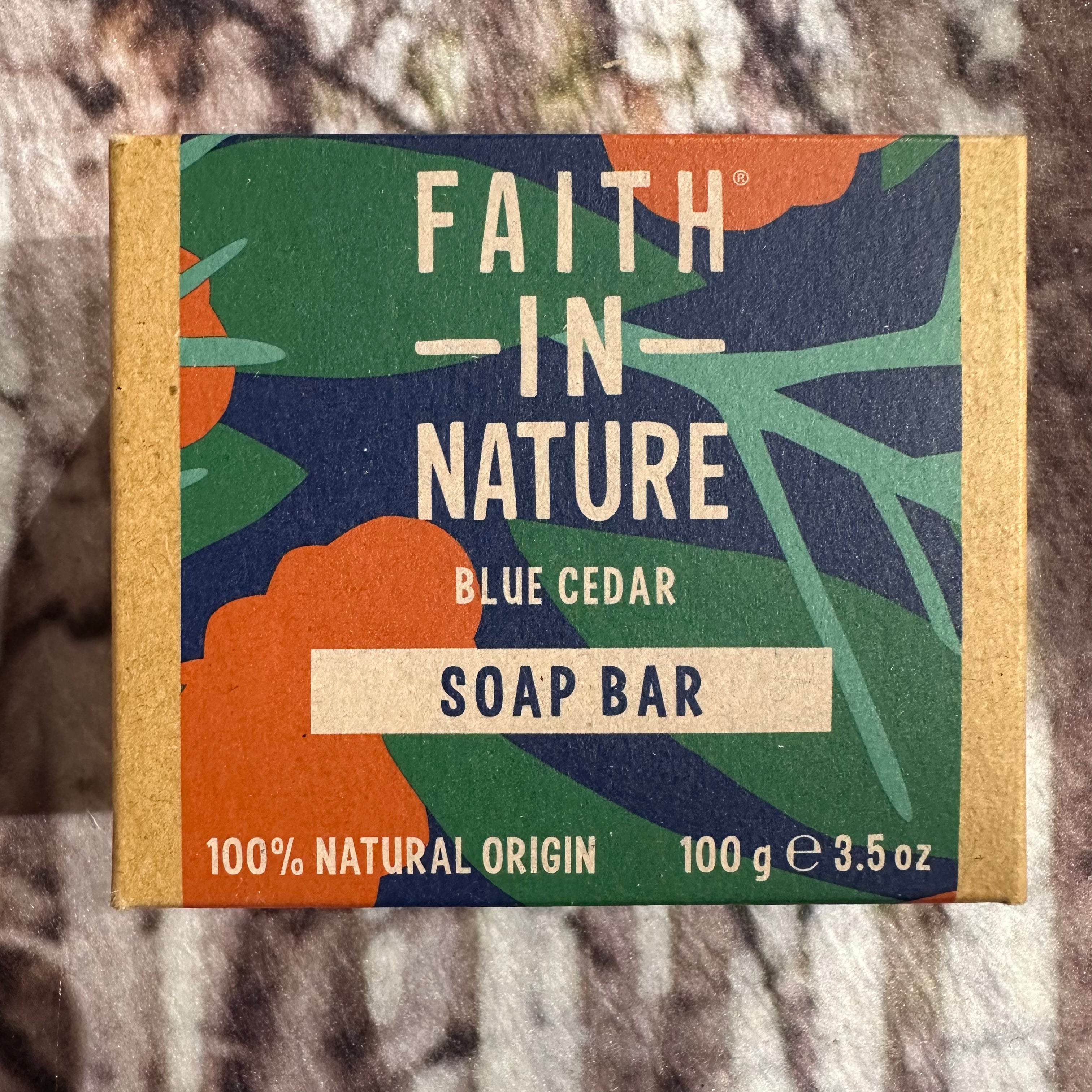 Soap bar packaging with 'Faith in Nature' branding on a textured background