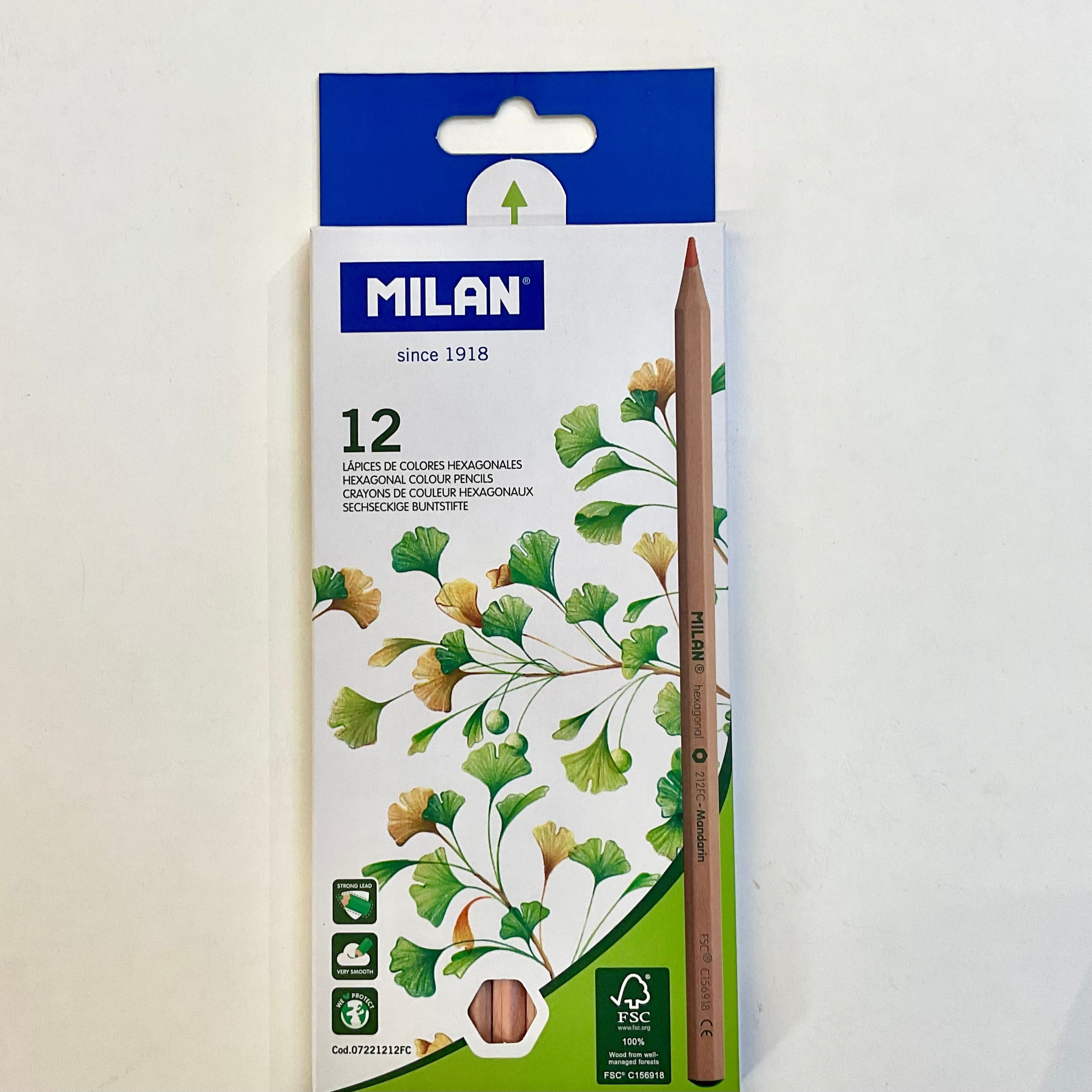 Pack of Milan colored pencils with a blue and white box on a light gray background