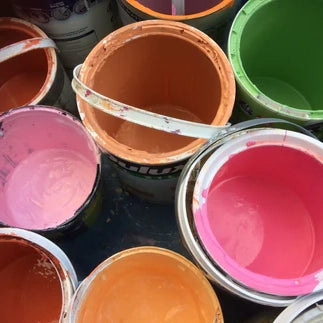 Assorted pots of colourful paint buckets