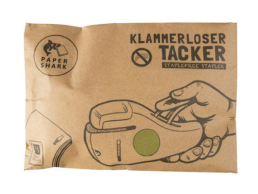 Paper Shark paper packaging for a staple-free stapler with branding and illustration of how it's used