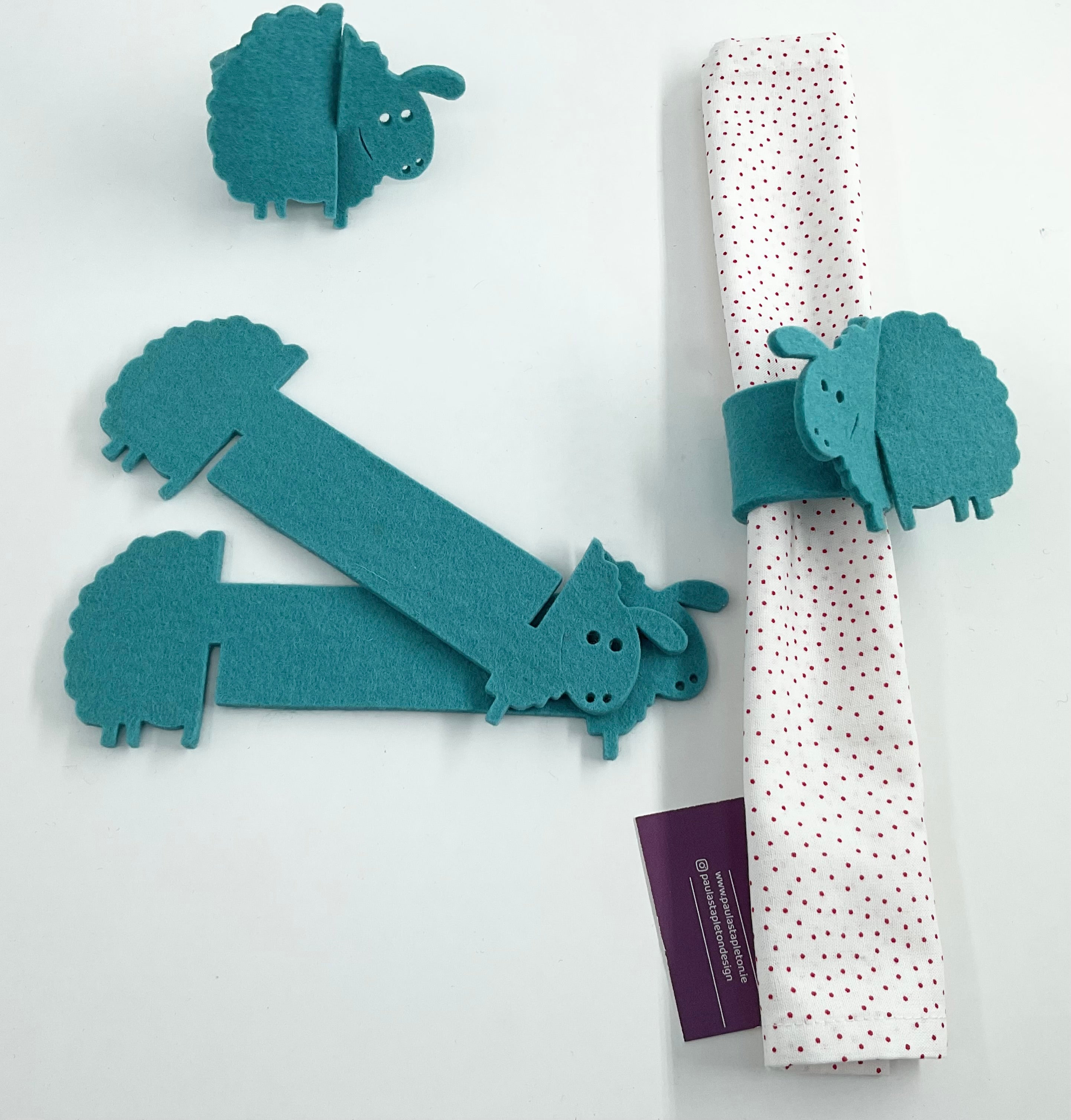 Sheep-shaped napkin holders on a white background