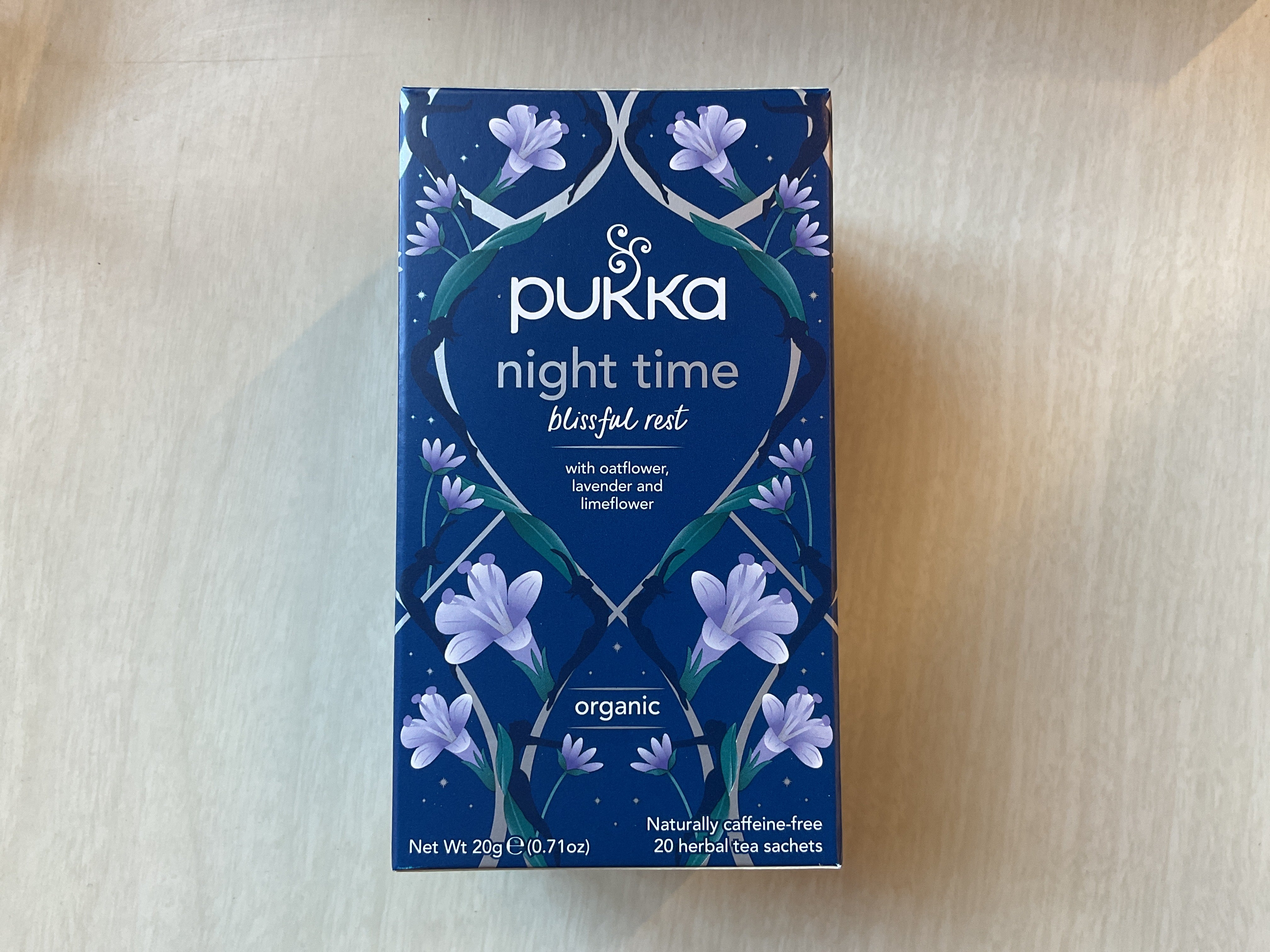 Box of Pukka Night Time Blissful Best herbal supplement with floral designs and product information on the label.