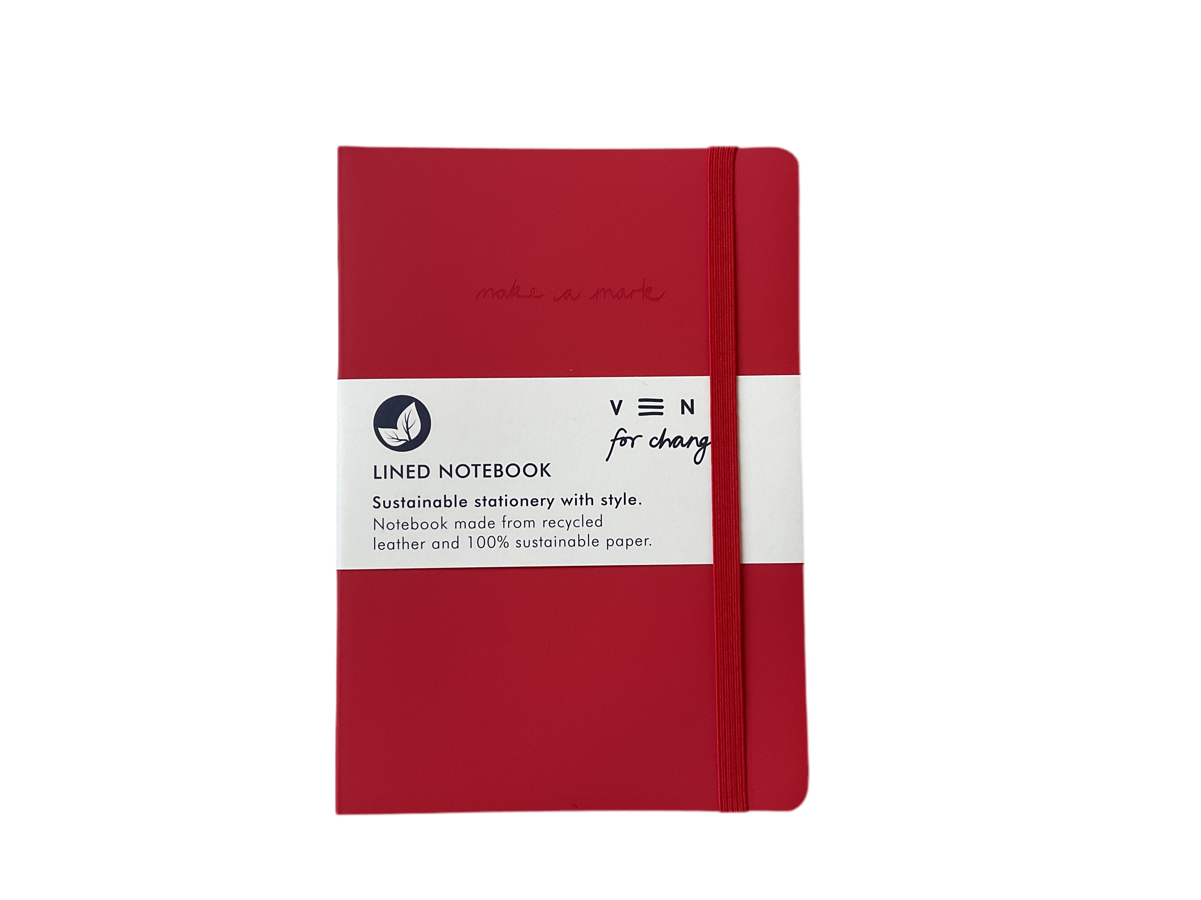 A red A5 lined notebook with a black spine, branded with 'VENT' on the cover and a label stating it is made with 100% recycled paper and leather.