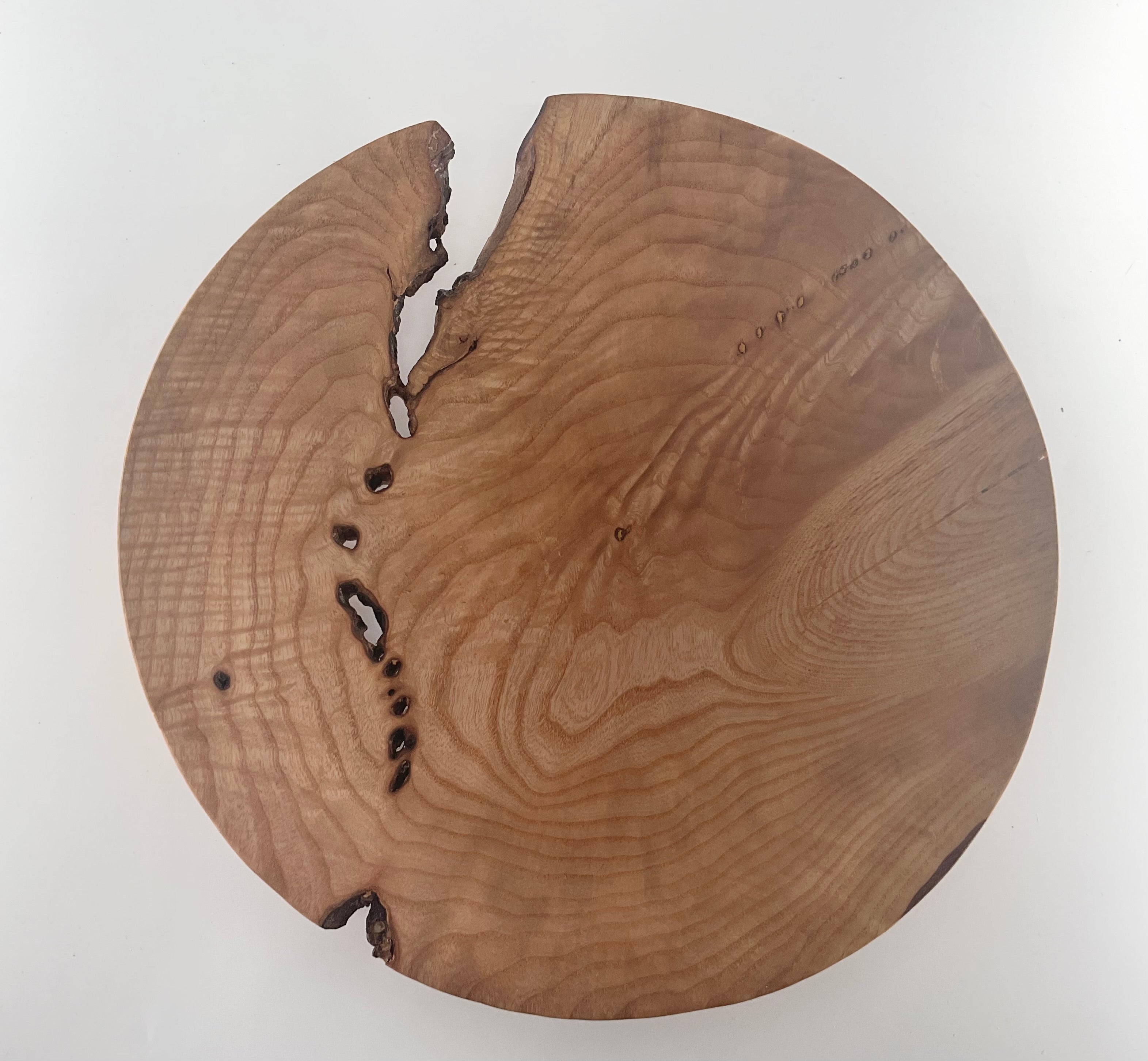 Wooden plate  with natural grain and texture on a white background