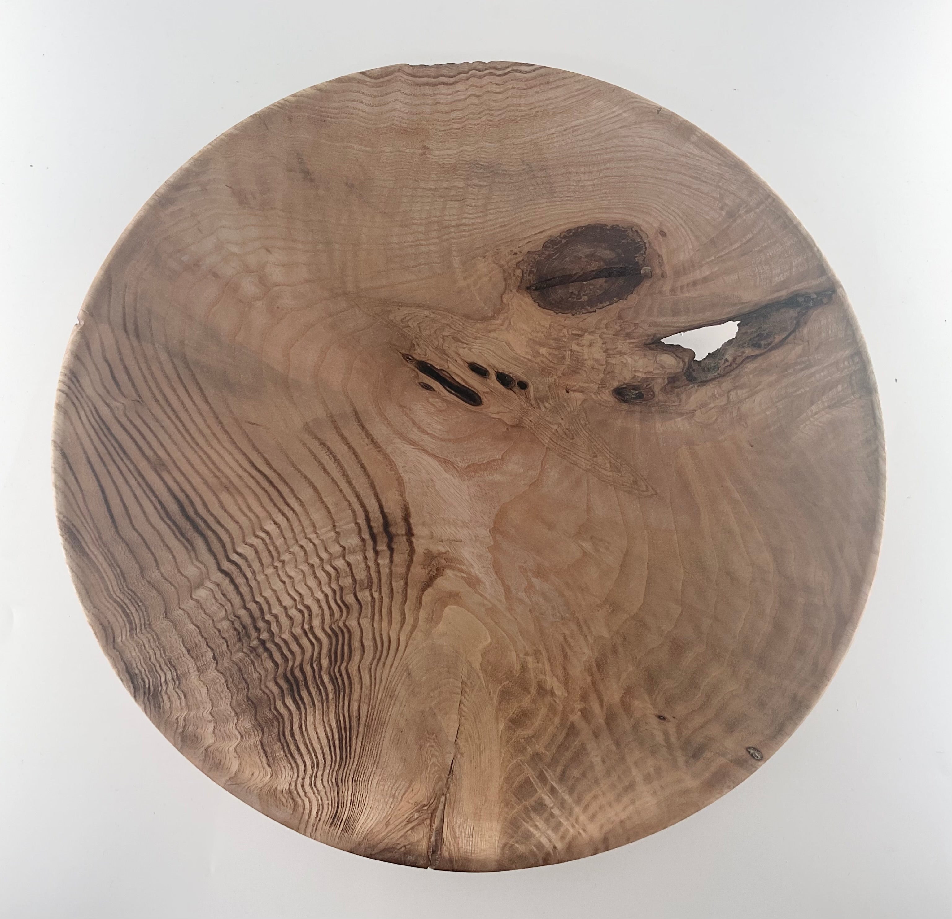 Wooden bowl with natural grain and texture on a white background