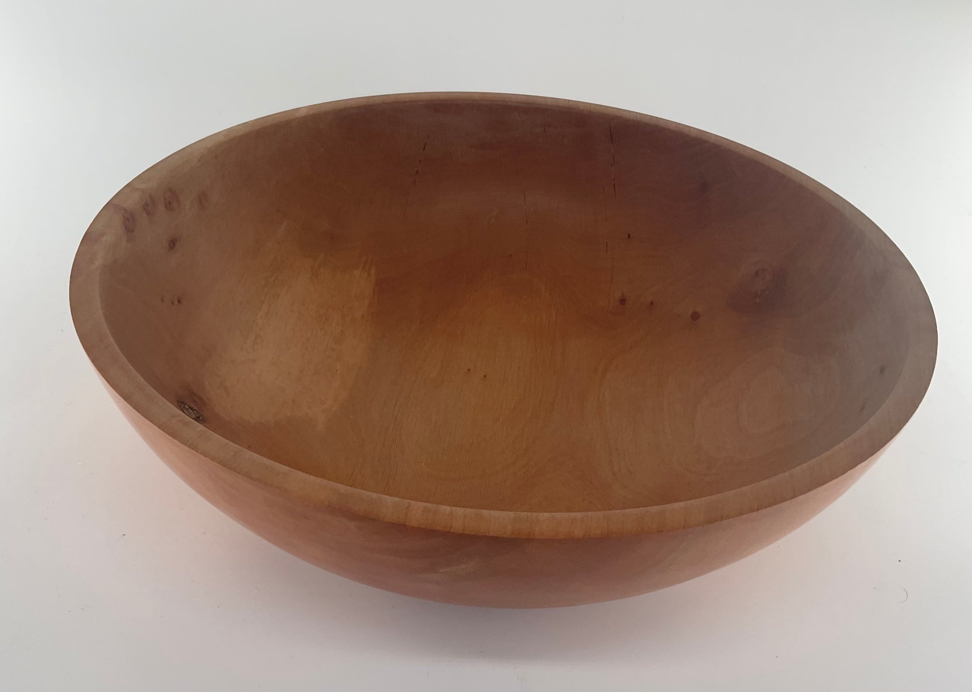 Wooden bowl on a white background