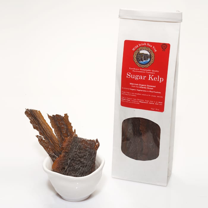 Sugar kelp with a white bowl and packaging on a white background