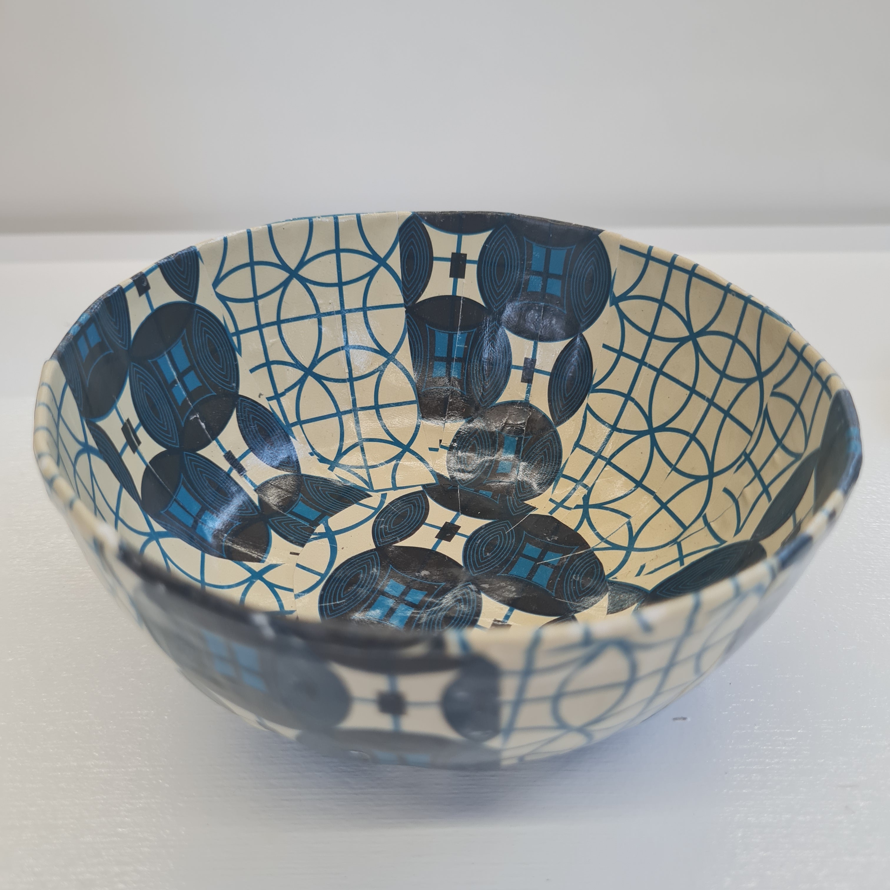 blue and beige paper mache bowl