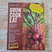 A book titled 'Grow Cook Eat' by Michael Kelly, featuring a cover image of fresh radishes and leafy greens on a wooden surface.