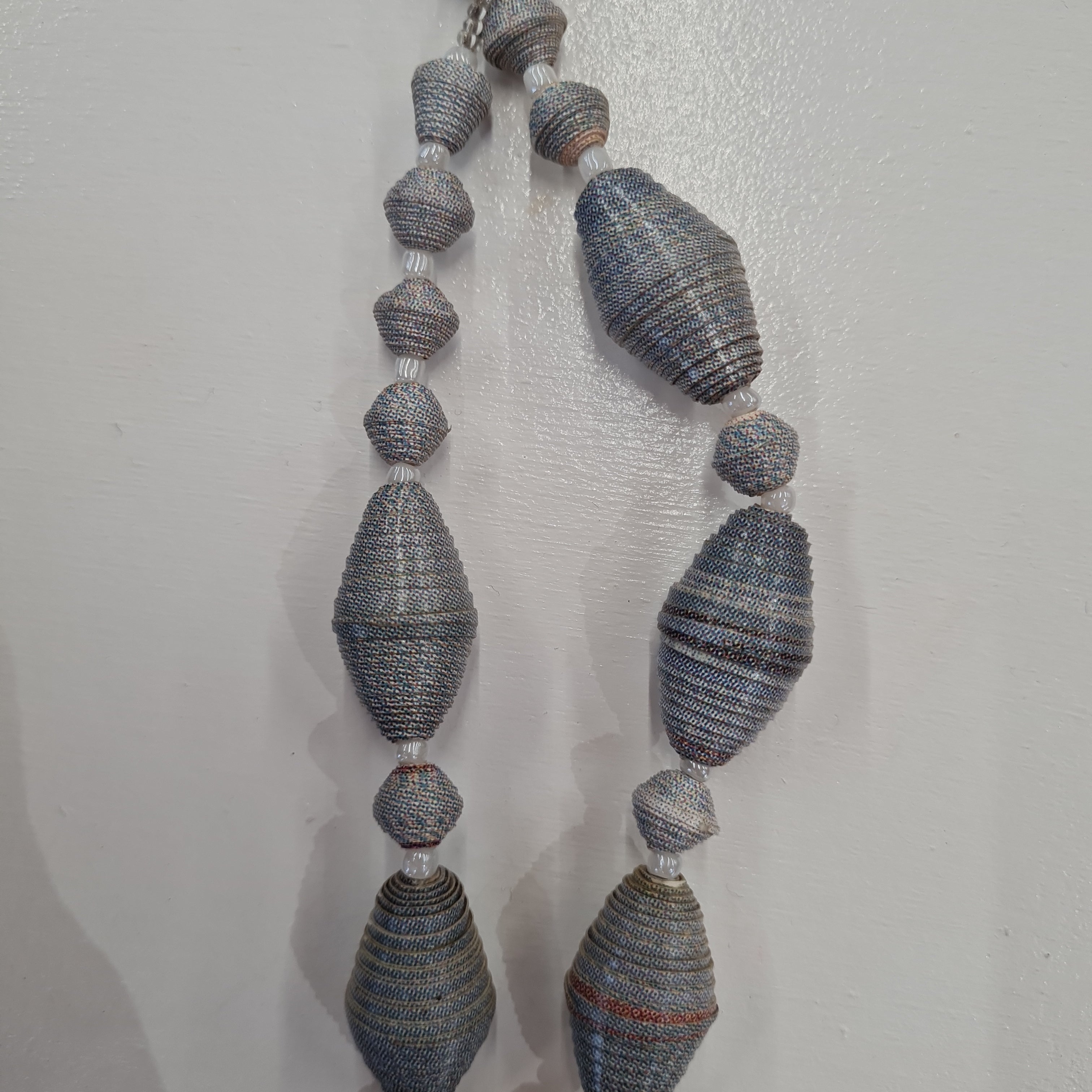 grey necklace handmade from magazines