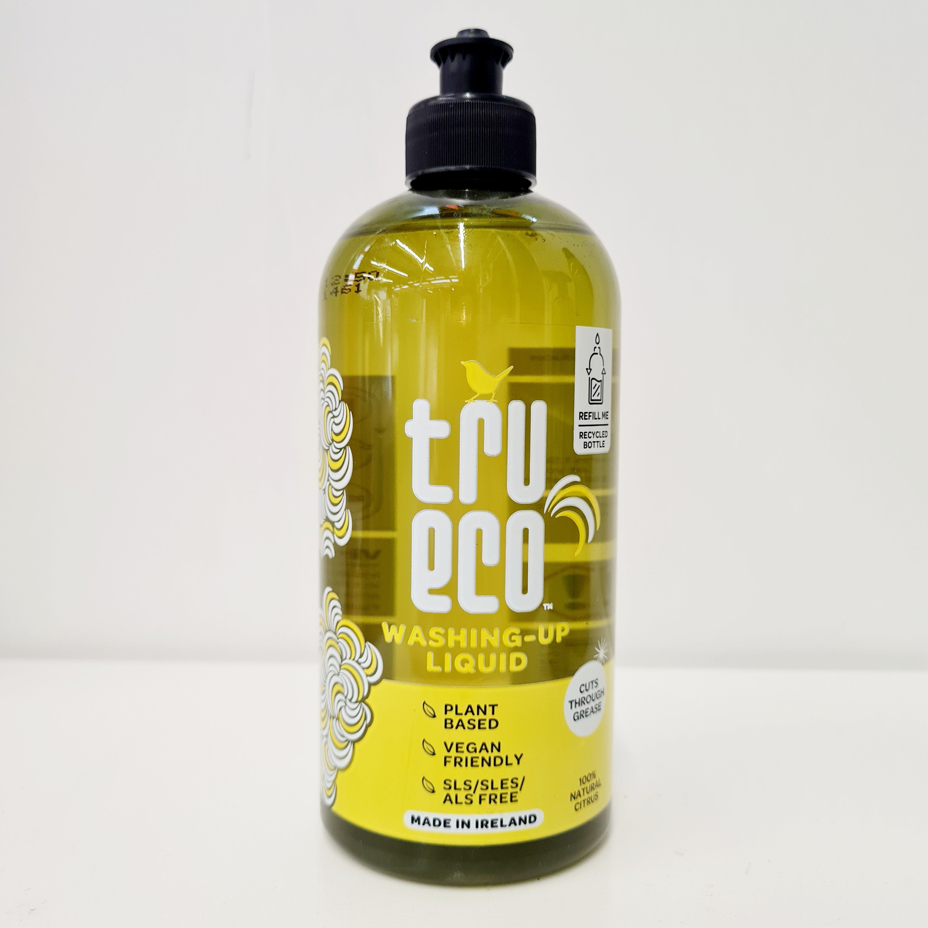 A bottle of TruEco Washing Up Liquid with a pump dispenser, featuring yellow and black labeling, and indicating that it is plant-based, vegan, and made in Ireland.