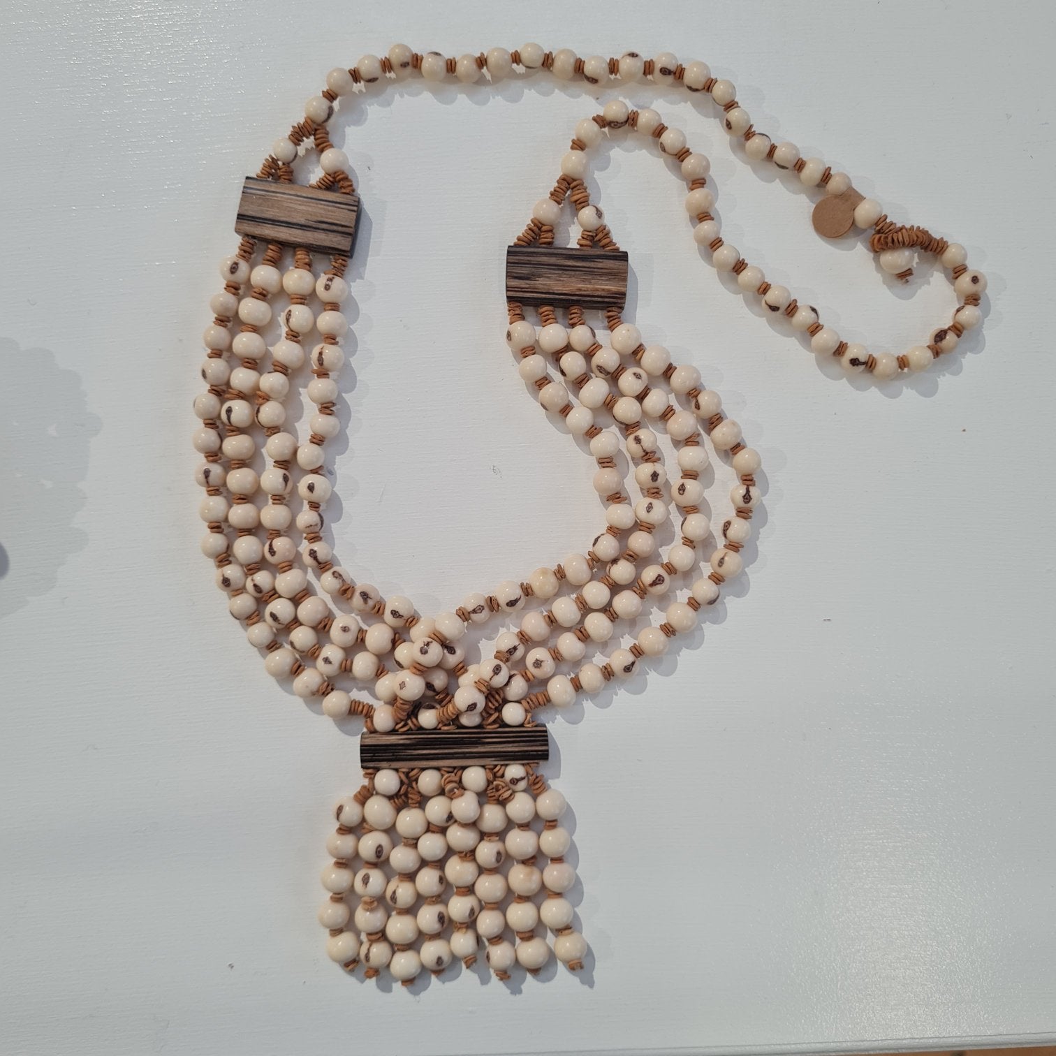 beaded necklace made from acai seeds